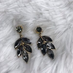 Leaf style gold earrings with black stones